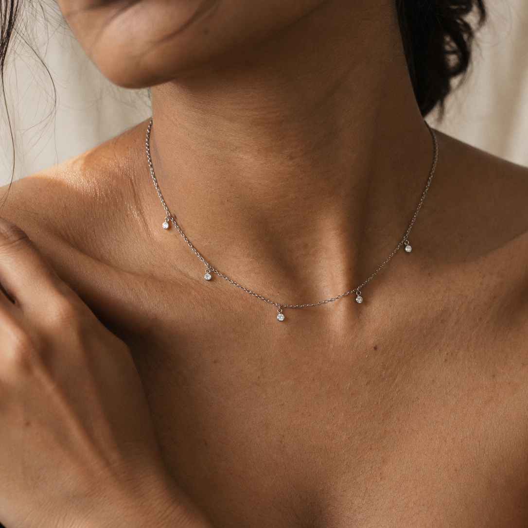 5 diamond charm necklace in silver and gold