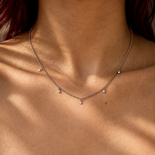 5 diamond charm necklace in silver and gold